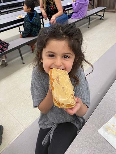 student eating donut