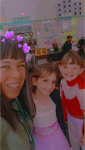 Staff member with two students