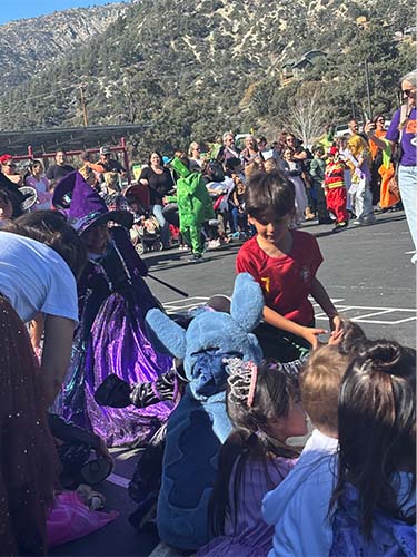 Students watching a costume parade