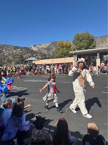 Two students walking in costume parade