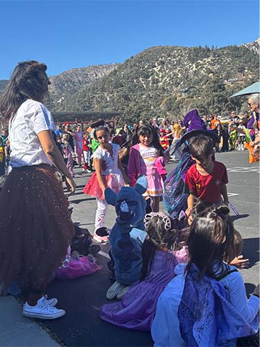 Group of students talking at costume parade
