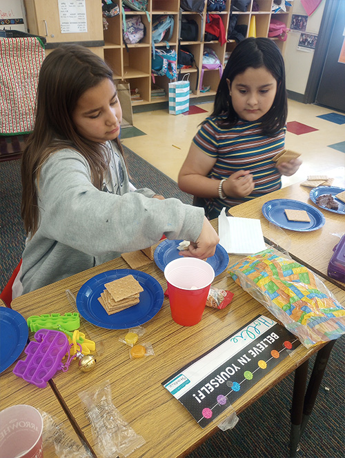 Two third grade girls focused on building a STEAM project