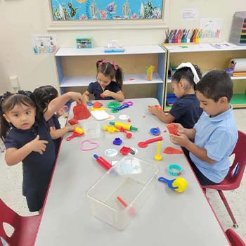 students playing with playdough