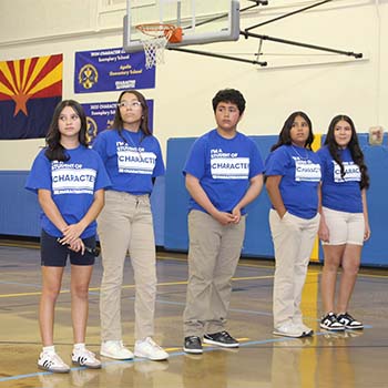 Four students at an award ceremony