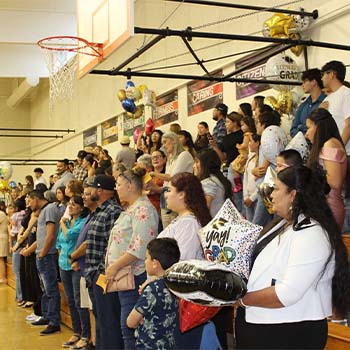 Parents in bleachers cheering