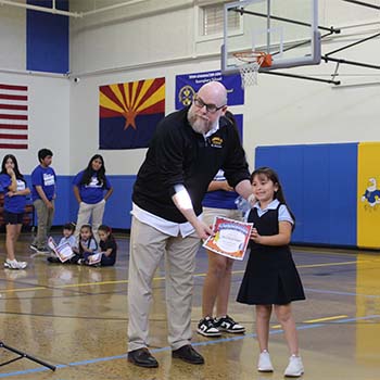 Young student receiving an award